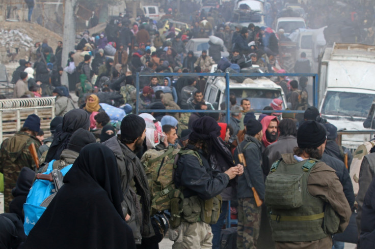 Rebel fighters and civilians gather 