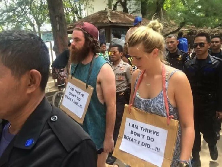 Tourists wear misspelt sign in Indonesia
