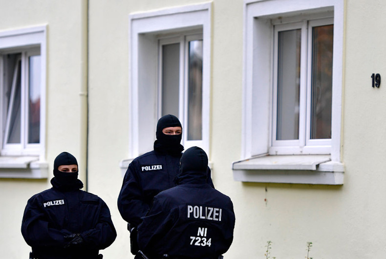 Heavily-armed police stand outside an apartment complex where hours earlier they arrested Ahmad Abdulaziz Abdullah A., alias 'Abu Walaa', a 32-year-old imam from Iraq, on November 8, 2016 in Hildesheim, Germany