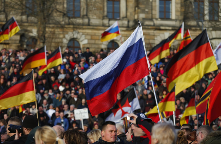 Supporters of the anti-Islam movement Patriotic Europeans Against the Islamisation of the West (PEGIDA) carry German and Russian flags during a demonstration in Dresden, Germany,