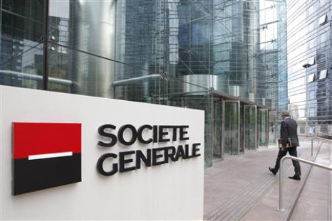 An employee enters the headquarters of French bank Societe Generale.