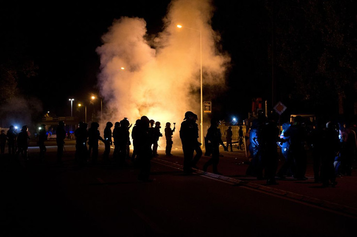 Police secures the new center for refugees on August 21, 2015 in Heidenau from attacks by far-right opponents of asylum accommodation.