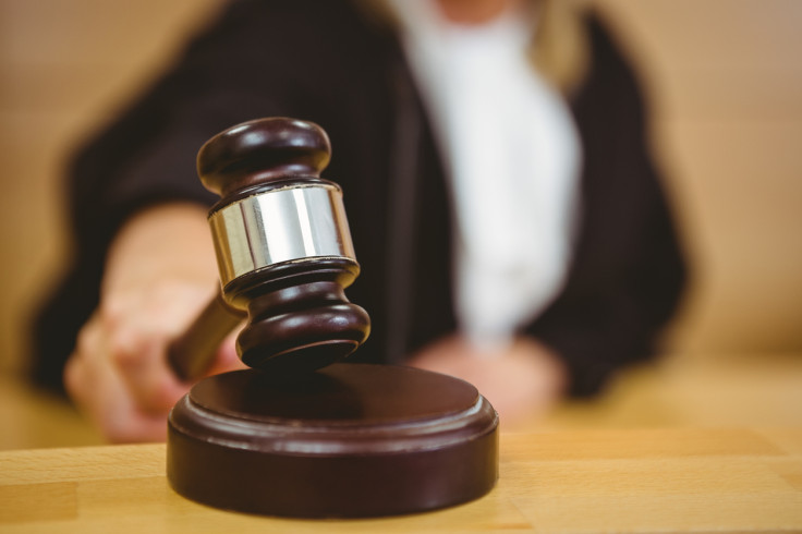 Female judge banging a gavel