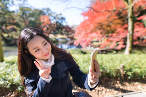 A Japanese woman taking a selfie