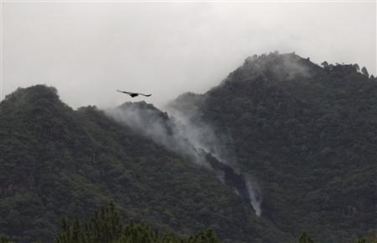 Smoke rises from the wreckage of a passenger plane which has crashed in The Margalla Hills on the outskirts of Islamabad