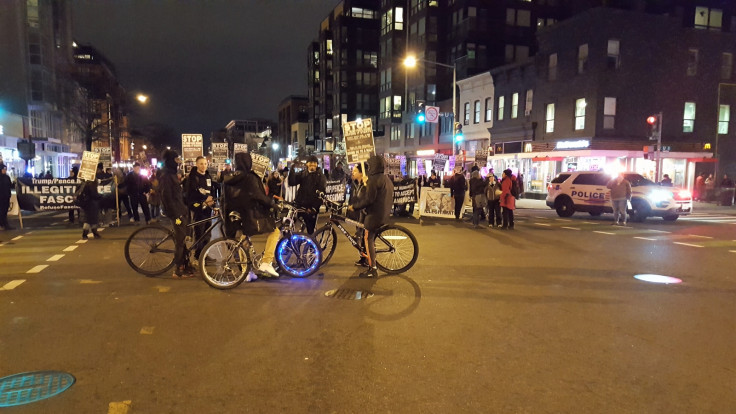 Boys on bikes with protesters in DC