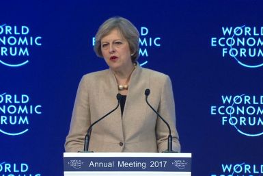 Theresa May warns big business in Davos