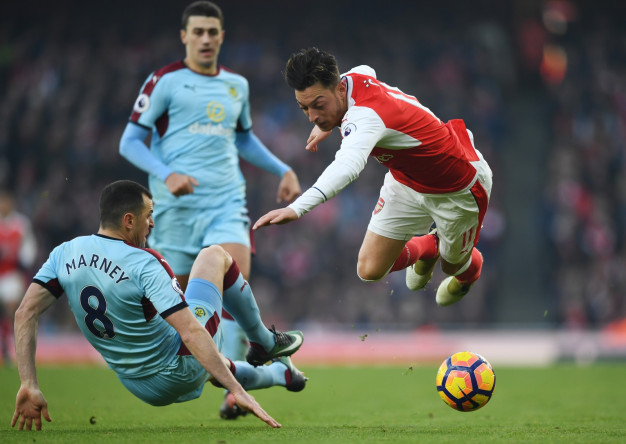 Dean Marney and Mesut Ozil Dean Marney and Mesut Ozil