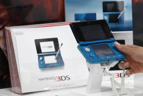 A man plays with the Nintendo 3DS at an electronics shop in Tokyo. REUTERS/Kim Kyung Hoon