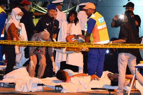 Medics attend survivors of Malaysia boat sinking