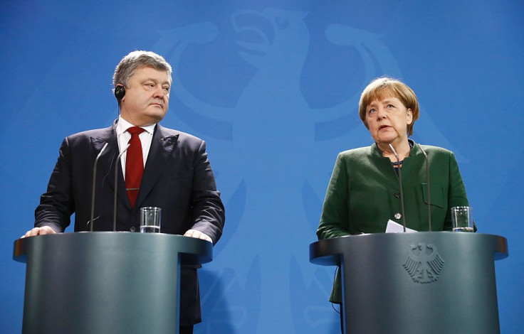 German Chancellor Angela Merkel and Ukraine's President Petro Poroshenko give press statements prior to their talks at the Chancellery in Berlin on January 30, 2017