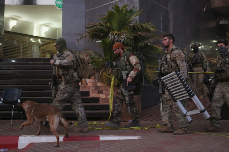 Soldiers leave the Radisson hotel in Bamako