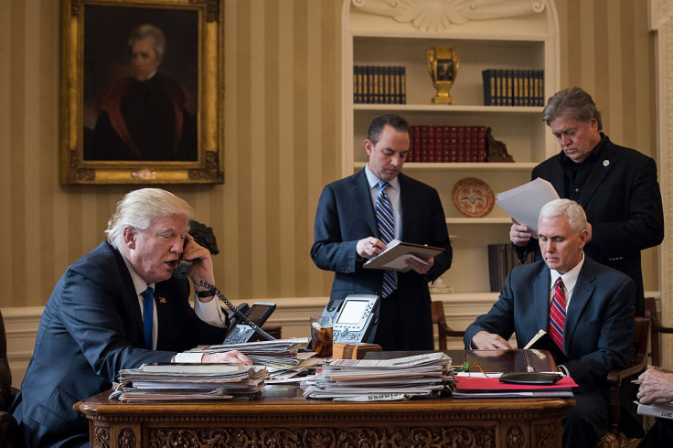 President Donald Trump speaks on the phone with Russian President Vladimir Putin in the Oval Office of the White House,