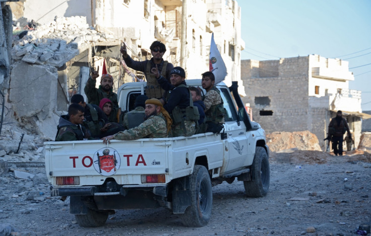 FSA fighters celebrate in al-Bab