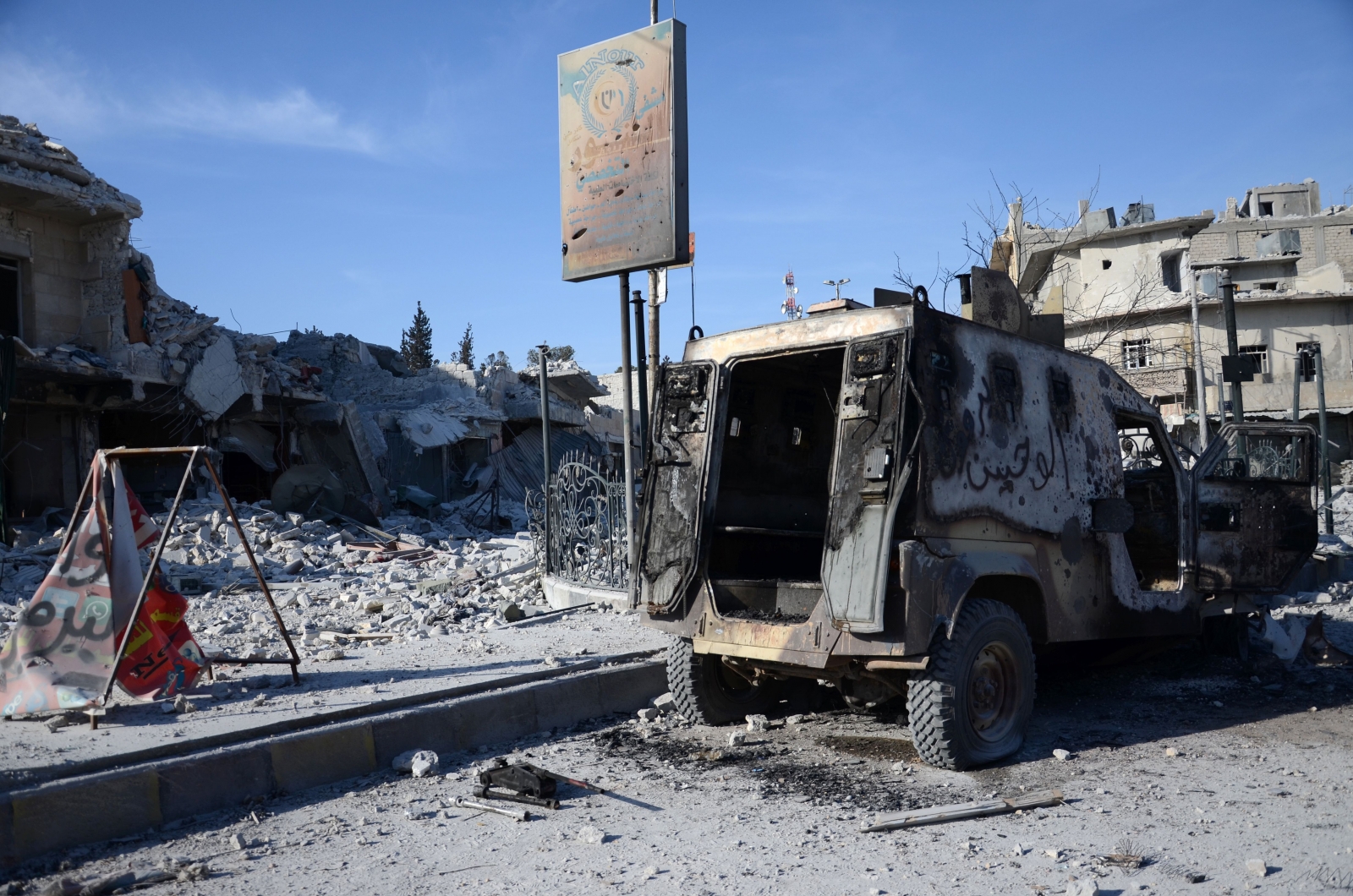 Burnt vehicle in al-Bab