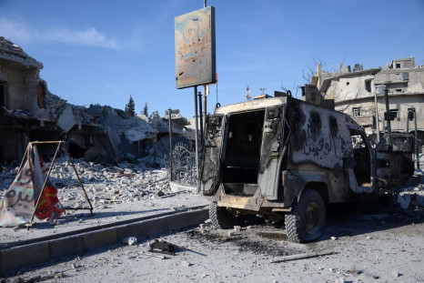 Burnt vehicle in al-Bab