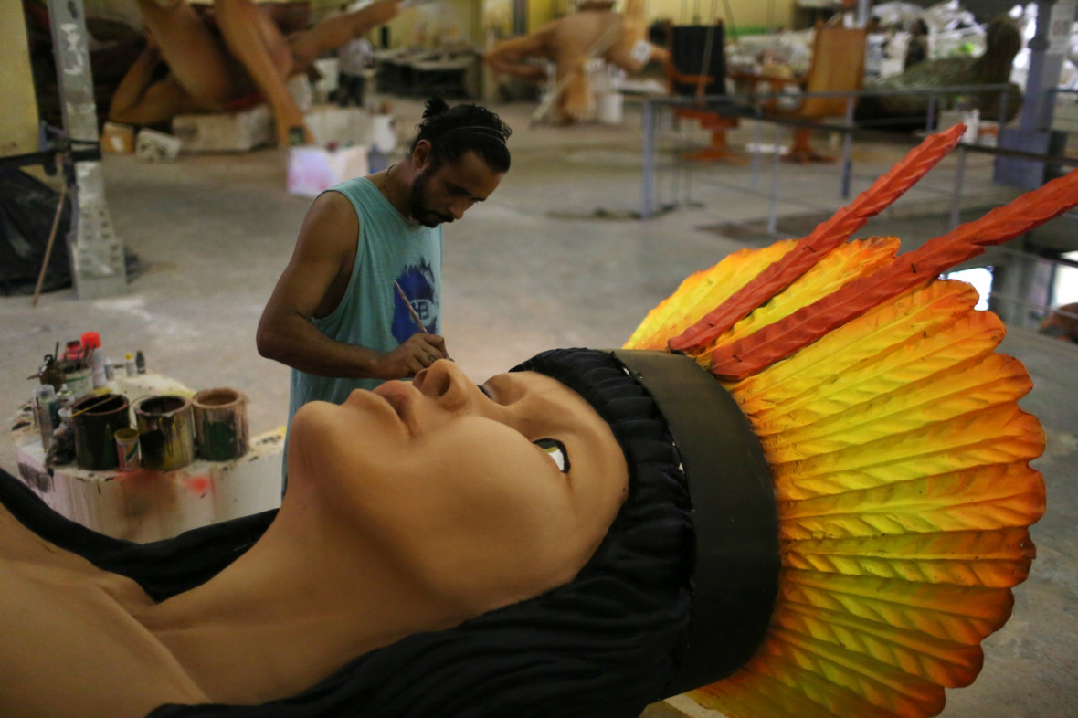 A worker from the Imperatriz Leopoldinense samba school prepares part of a carnival float A worker from the Imperatriz Leopoldinense samba school prepares part of a carnival float