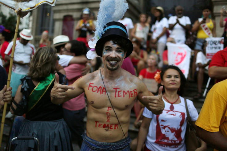The party gets political as revellers take part in block party Fora Temer (Out Temer)