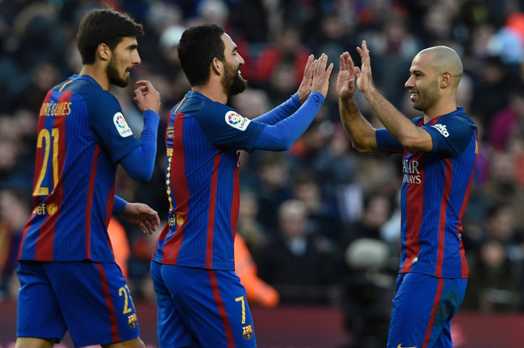 Arda Turan and Javier Mascherano