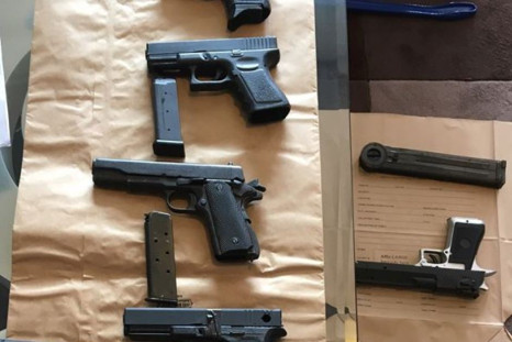 A cache of 3D printed pistols