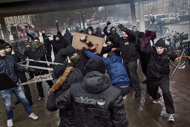 Right-wing extremists clash with members of an anti-Nazism demonstration in the Stockholm suburb of Karrtorp December 15, 2013. 
