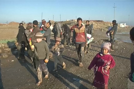 Civilians flee Mosul on muddy roads as battle rages on