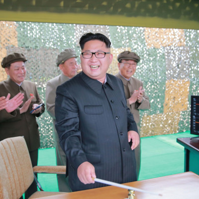 North Korean leader Kim Jong-Un (C) inspecting a test of the surface-to-surface medium long-range strategic ballistic missile 