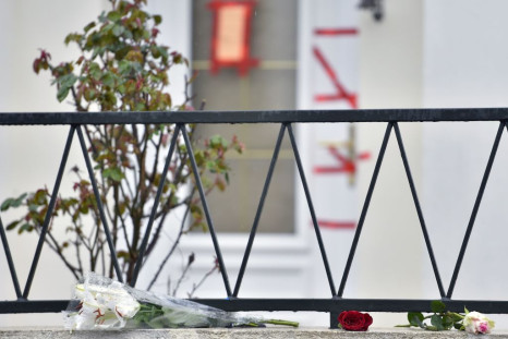 a bunch of flowers and roses laid in front of the entrance of the house of the Troadec family, the day after the brother in law of the father, Hubert Caouissin confessed the killing of all four members of the family.