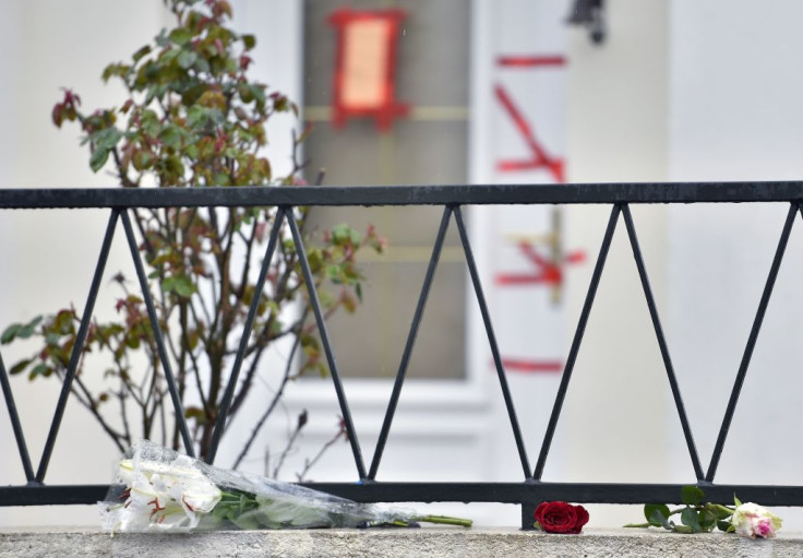 a bunch of flowers and roses laid in front of the entrance of the house of the Troadec family, the day after the brother in law of the father, Hubert Caouissin confessed the killing of all four members of the family.