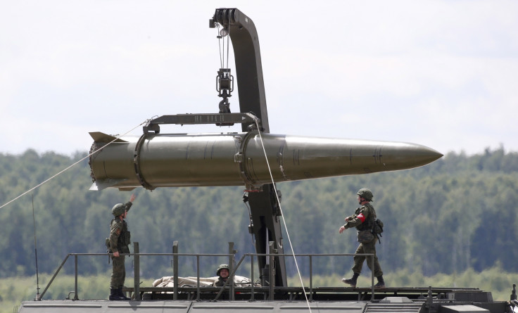 Russian servicemen equip an Iskander tactical missile