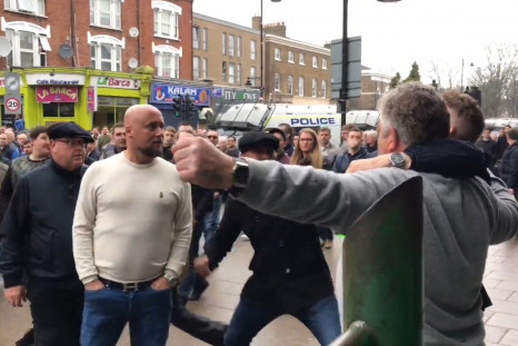 Millwall fan punches Tottenham supporter