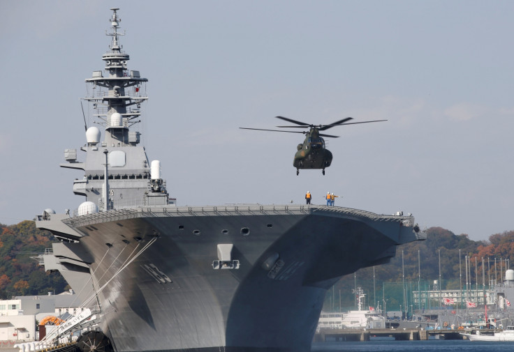 A helicopter lands on the Izumo, Japan Maritime Self Defense Force's (JMSDF) helicopter carrier