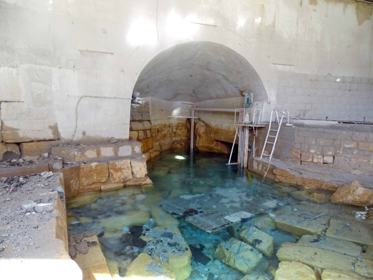 Damage is seen in the water pumping station in the village of Ain al-Fija