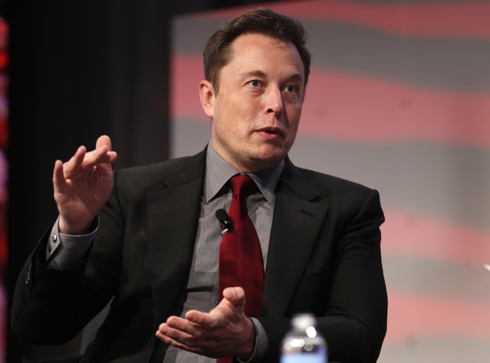 How much is Elon Musk worth, and where did his fortune come from?