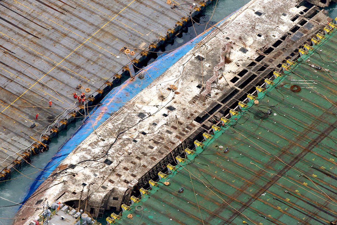 In pictures South Korea's Sewol ferry emerges from the sea nearly