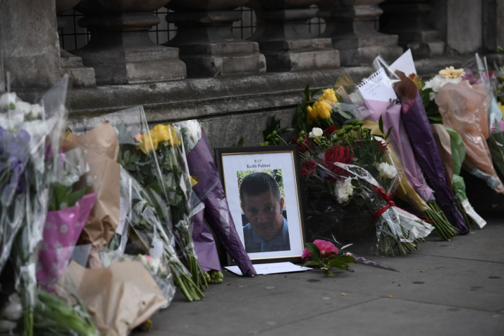 Flowers are left with a memorial to Police Constable Keith Palmer who was stabbed as he tried to stop an attacker in a courtyard outside the Houses of Parliament 