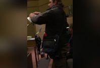 Protester tears apart Quran Protester tears apart Quran