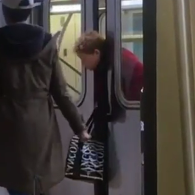 Woman with head stuck in subway