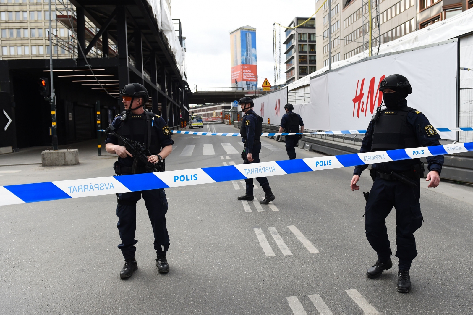 Police officers cordon off the scene where a truck crashed into the Ahlens department store at Drottninggatan in central Stockholm Police officers cordon off the scene where a truck crashed into the Ahlens department store at Drottninggatan in central Stockholm