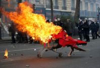 Protestors clash with riot police during May Day labour union march in Paris