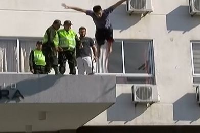 Teenager miraculously survives after headfirst swan dive off building
