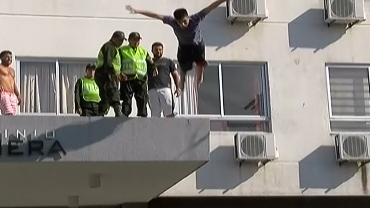 Teenager miraculously survives after headfirst swan dive off building