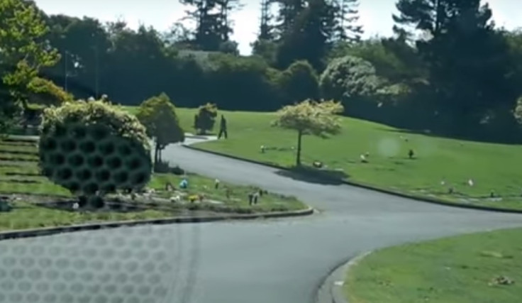 Cemetery workers play golf on graves