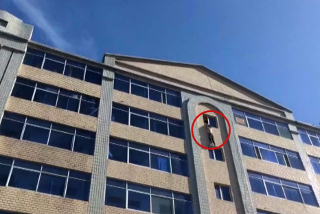 Watch Firefighters Rescue Man From Jumping Off Building