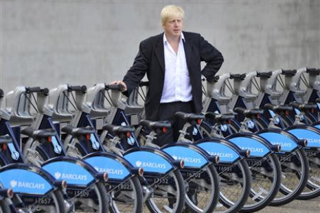 London Mayor Johnson poses with hire cycles beside the London Eye in central London
