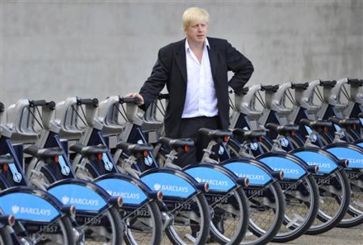 London Mayor Johnson poses with hire cycles beside the London Eye in central London