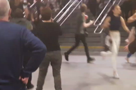 People run through Manchester's Victoria Station following explosions 
