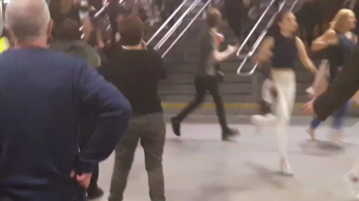 People run through Manchester's Victoria Station following explosions 