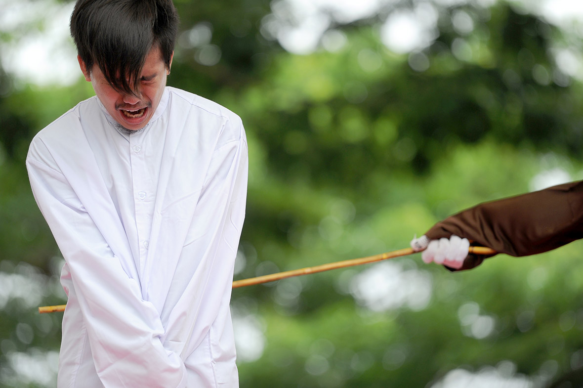 gay couple caned Aceh Indonesia shariah