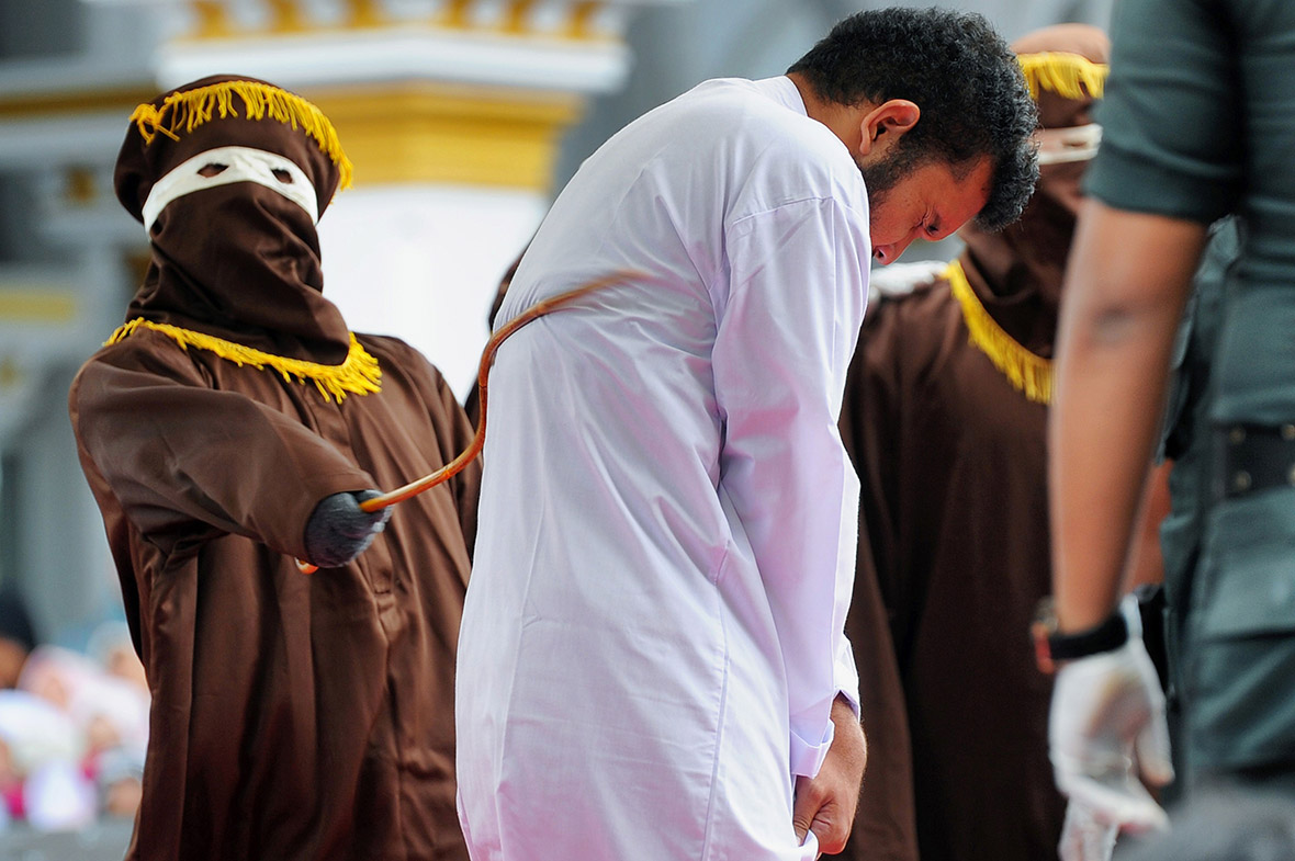 gay couple caned Aceh Indonesia shariah